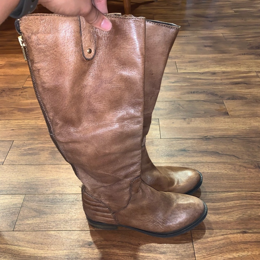 8.5 Brown leather boots with gold accent heals.